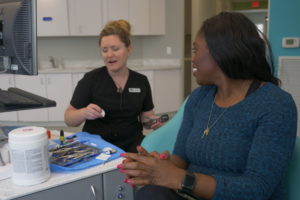 Swan staff talking with a patient